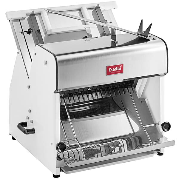 A white and silver Estella countertop bread slicer with a crumb tray and a handle.