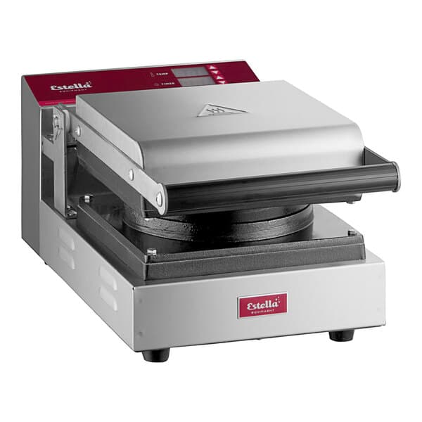 A Estella commercial Belgian waffle maker with a black lid.