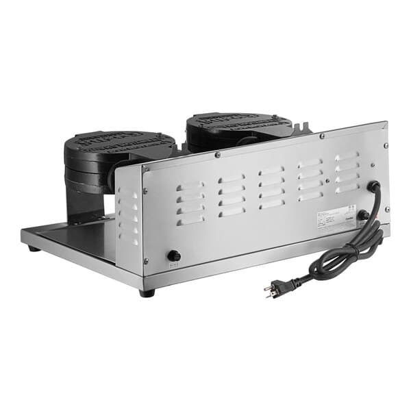 A silver and black Estella double waffle maker with two round black objects.