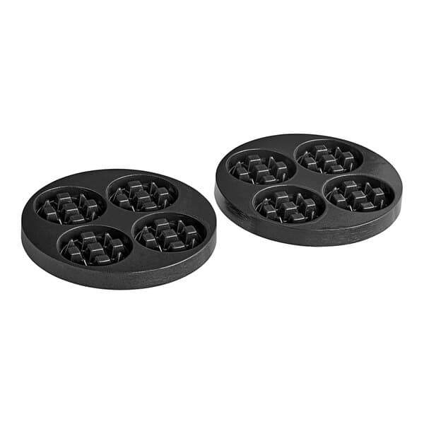 A pair of black circular Estella mini waffle plates with holes in them.