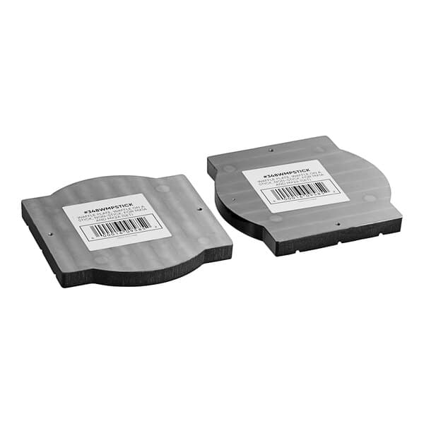 Two black and white plastic disks with barcodes for an Estella Waffle on a Stick Plate.
