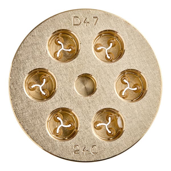 A circular brass Estella Fusilli Pasta Die with holes in it.