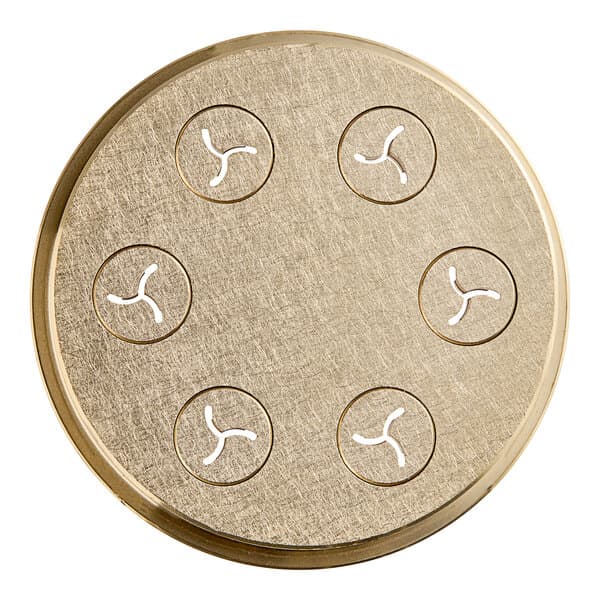 A circular brass object with holes in it.