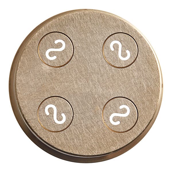 A circular metal Casarecce pasta die with white marks on it.
