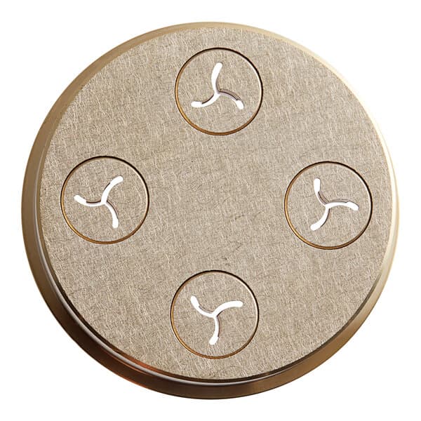 A round metal object with four circular holes.