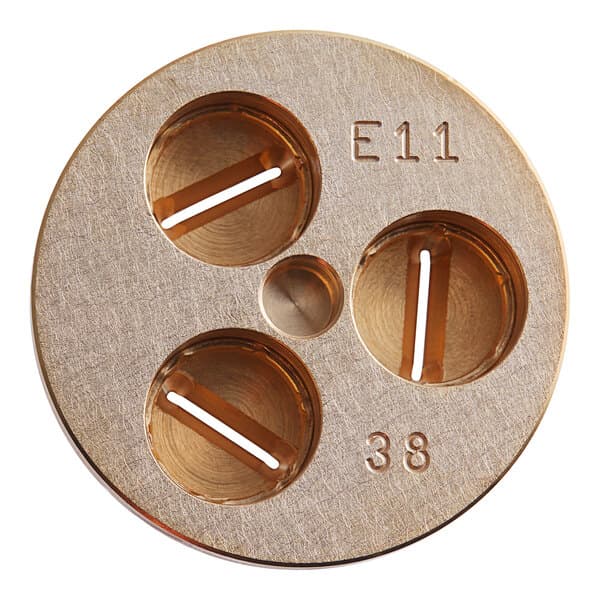A circular metal Estella Pappardelle pasta die with three holes in it.