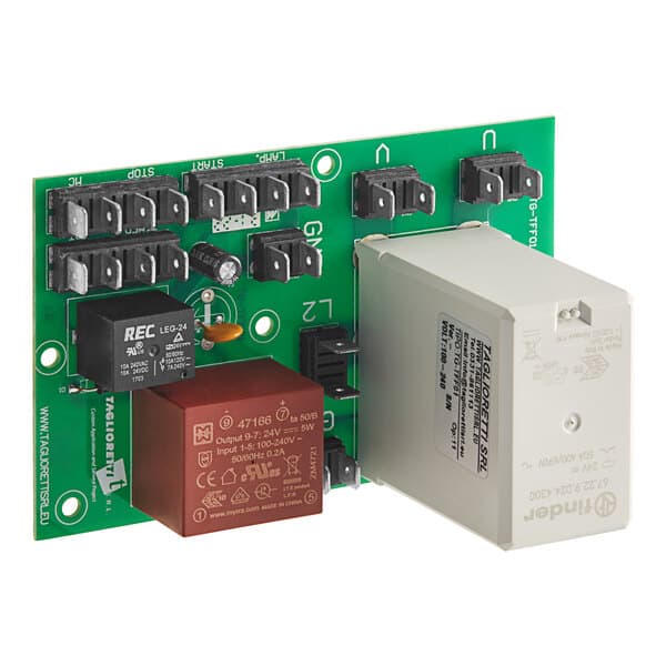 A green Estella power board with two white and brown boxes and black and white components.