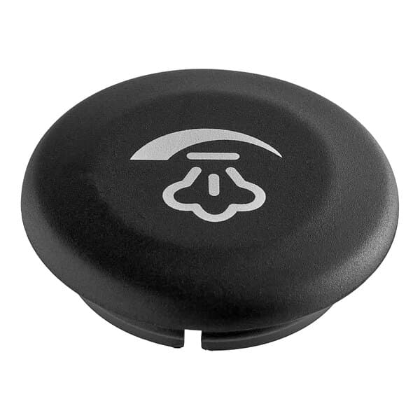 A black round knob with a white symbol on it.