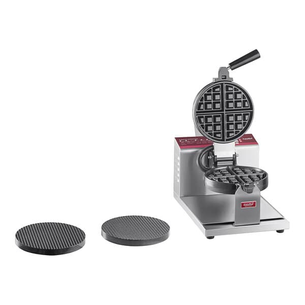 A white Estella commercial waffle maker with waffle and waffle cone plates.