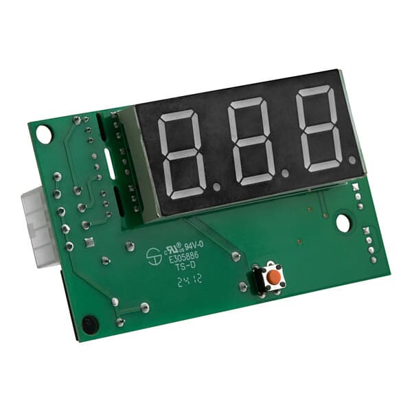 A green circuit board with a black digital display with numbers.
