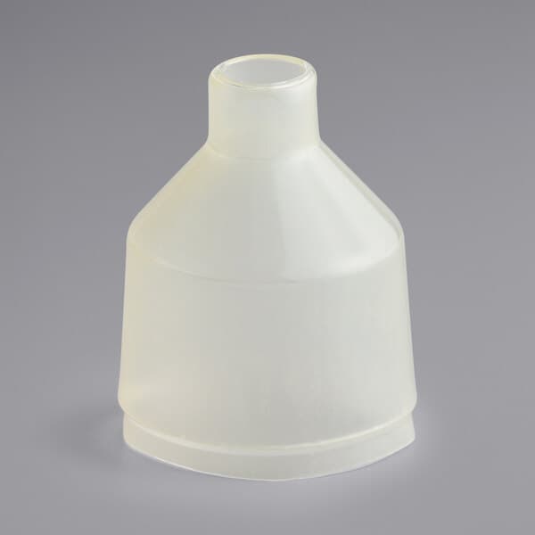 A white plastic cover for an Estella Caffe espresso machine switch on a gray background.