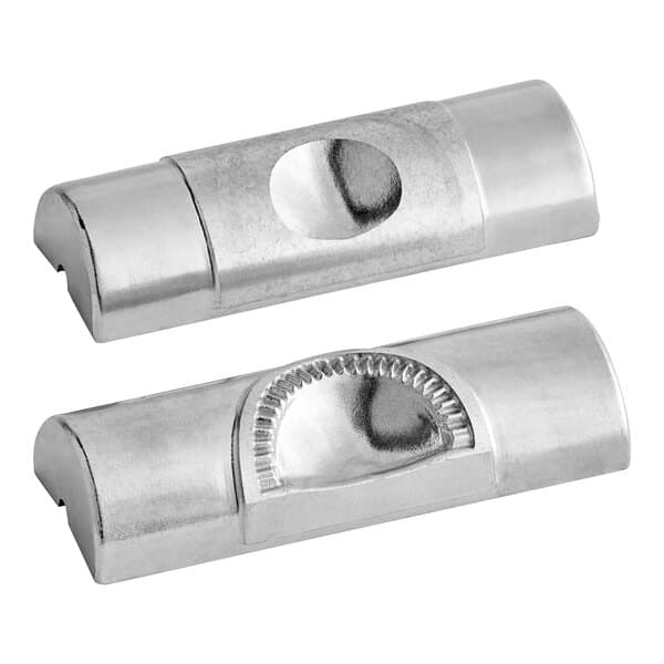 A close-up of a silver semi-circle die.
