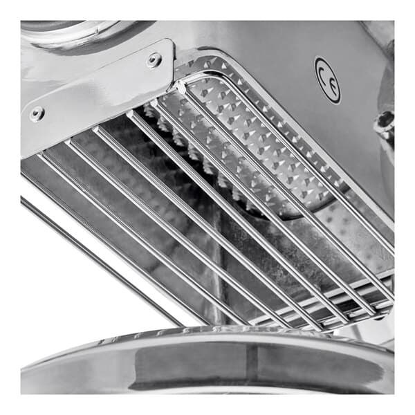 A close-up of the stainless steel Estella Electric Hard Cheese Grater plate.